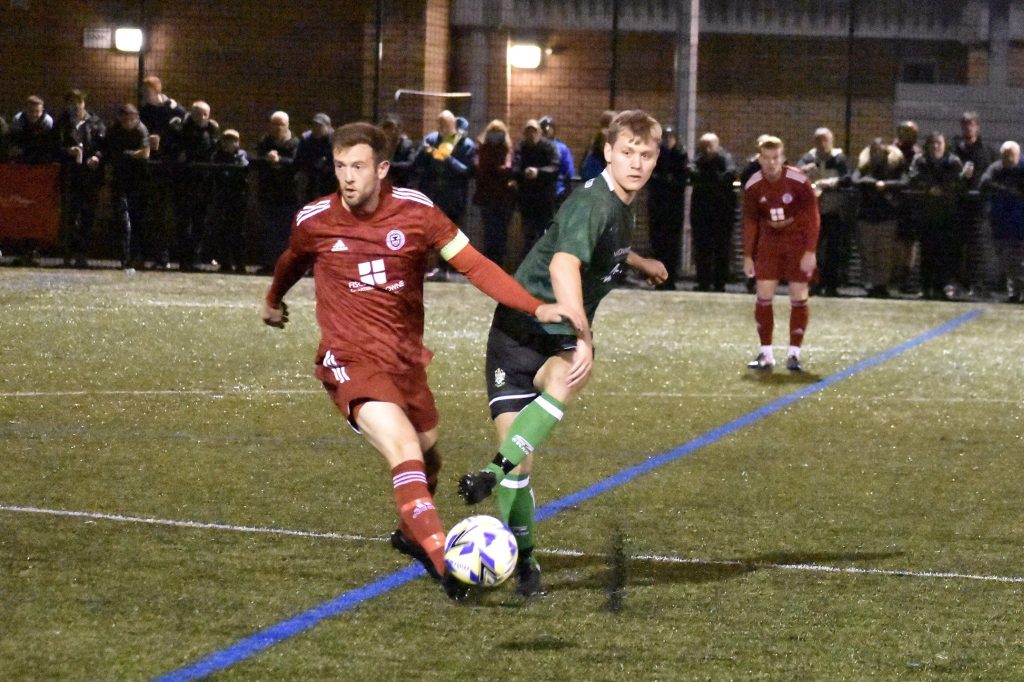 Lower Breck and Burscough battle for possession
