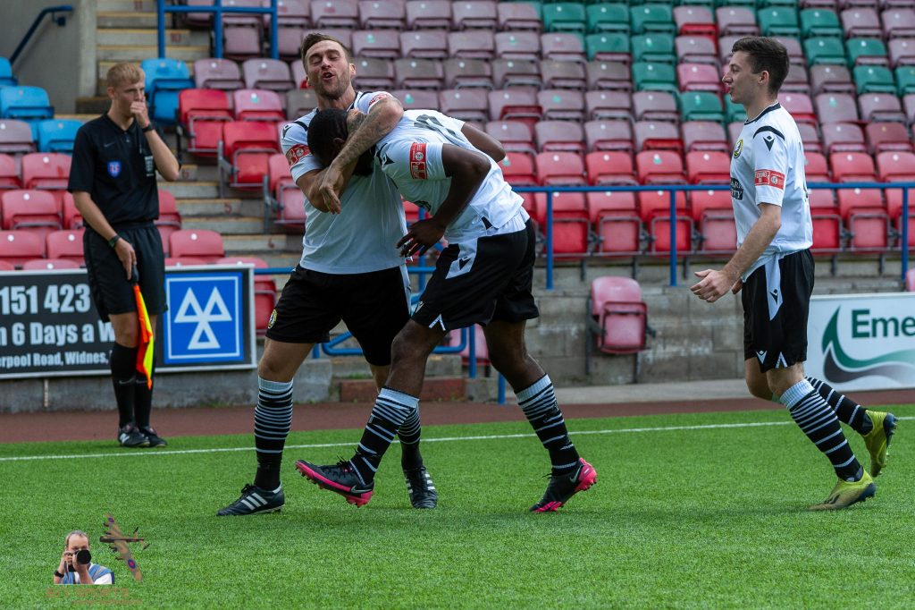 Widnes celebrate after scoring against Brighouse