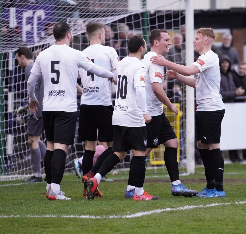 Marine celebrate the opening goal against Kendal Town