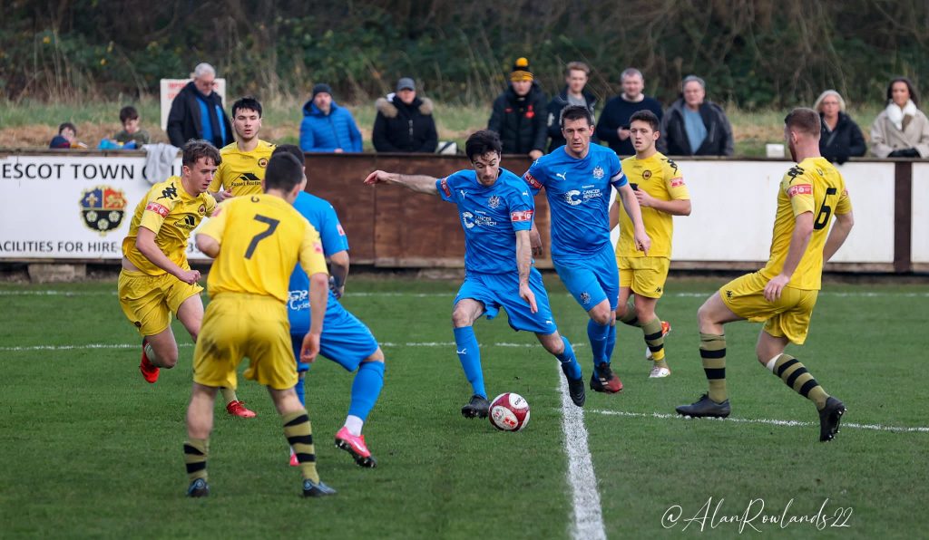 Marine in action against Prescot Cables in the Northern Premier League West