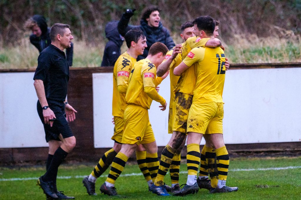 Prescot Cables celebrating after scoring the winner vs Newcastle Town