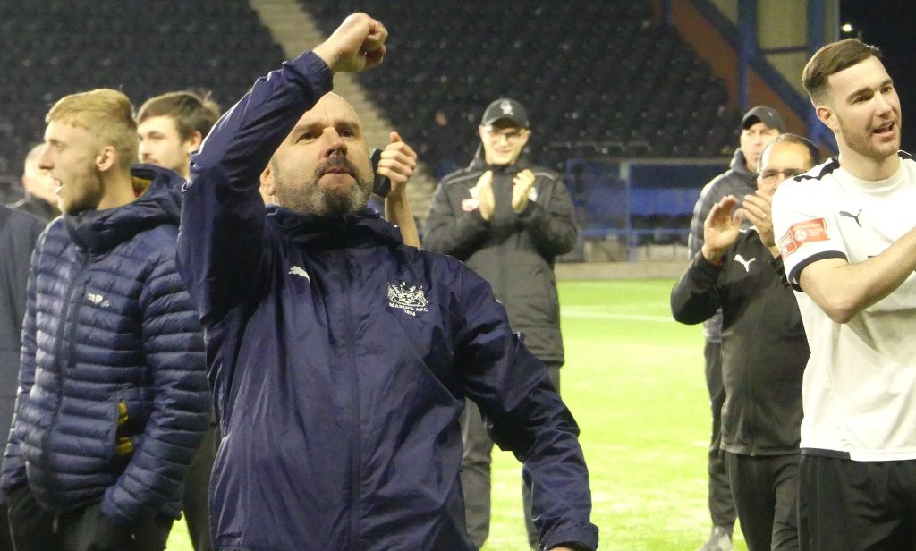 Marine manager Neil Young celebrates winning Liverpool Senior Cup